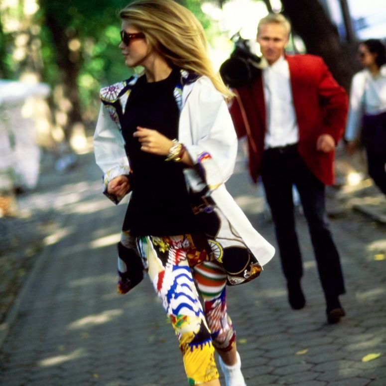 Image may contain: Clothing, Apparel, Human, Person, Footwear, Shoe, Shorts, Pedestrian, Sunglasses, and Accessories